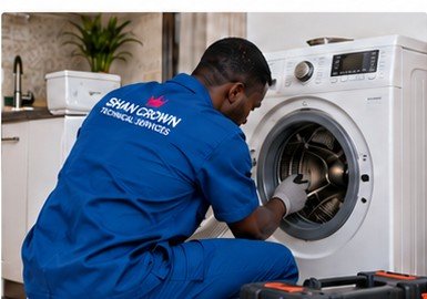 Shan Crown technician repairing a washing machine drum